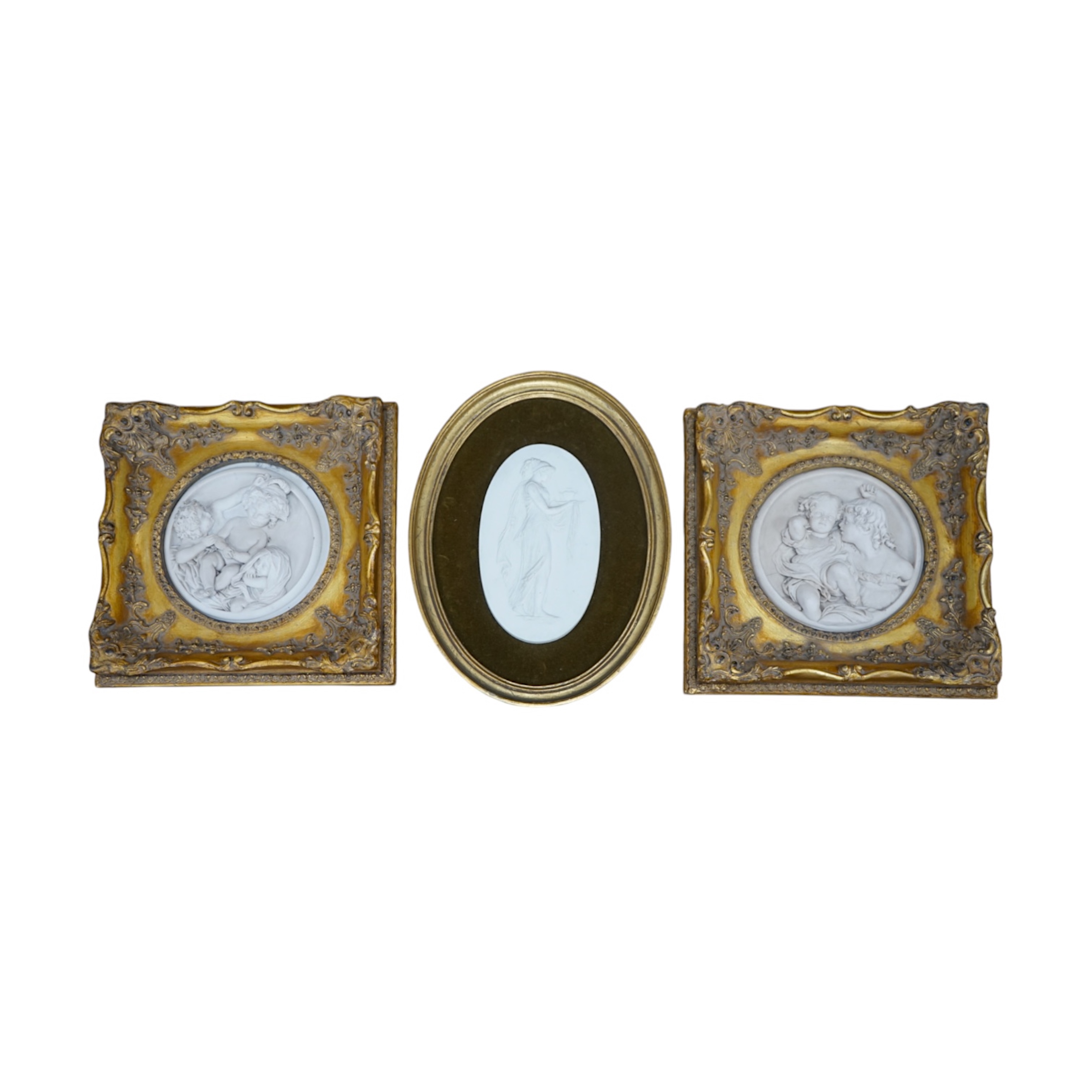 A pair of framed faux marble plaques and a similar oval plaque. Condition - good